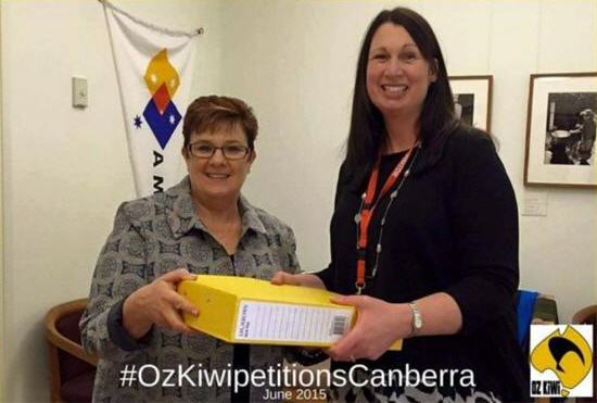 Senator Ann Urquhart accepting the Oz Kiwi petition from an Oz Kiwi representative